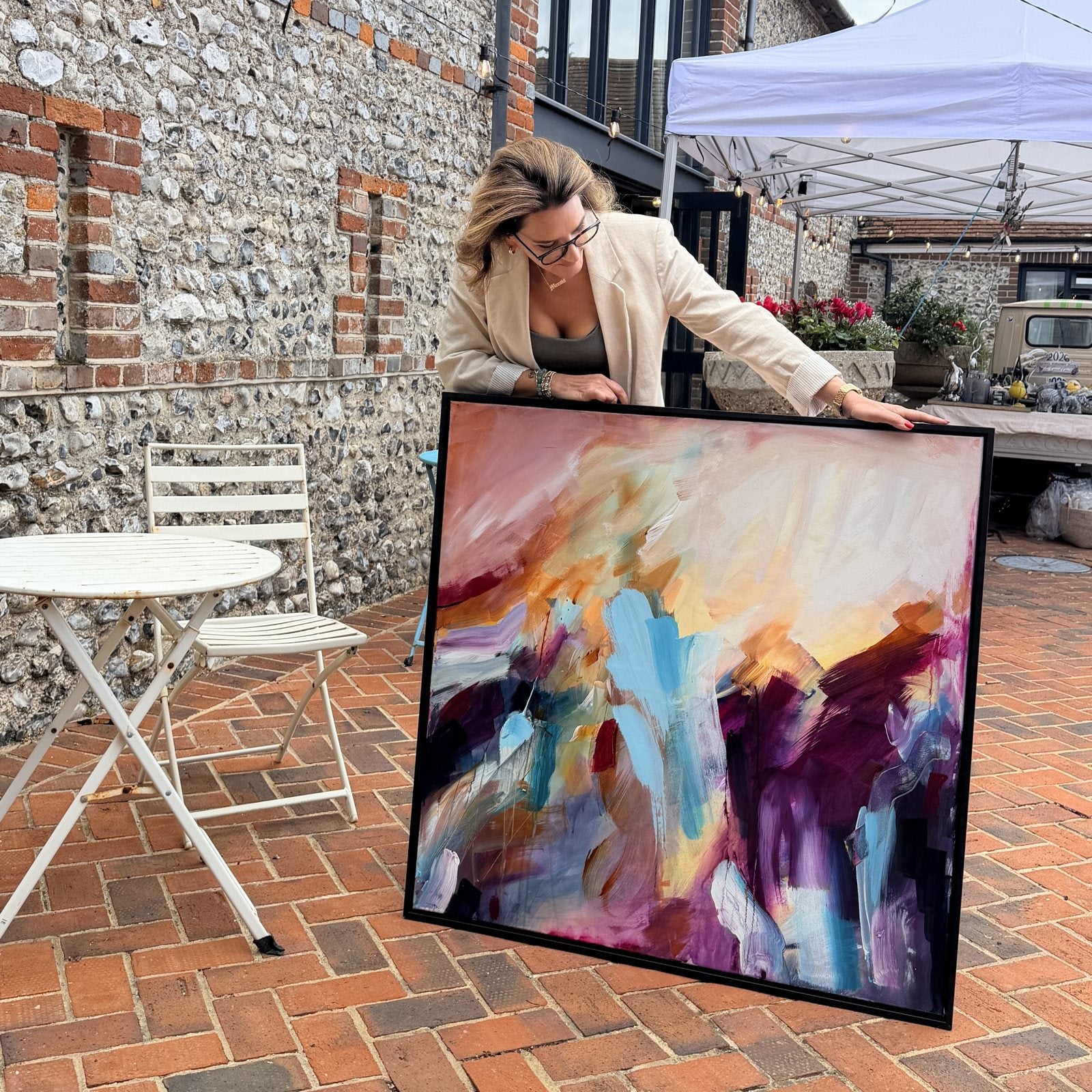 Joanna Gilbert with Rise into Colour, original abstract painting in a black float frame