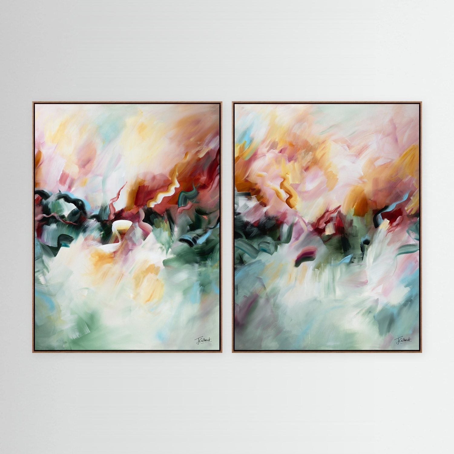 A Sunset's Embrace abstract diptych in oak frames, a pair of vertical framed canvas prints by Joanna Gilbert.