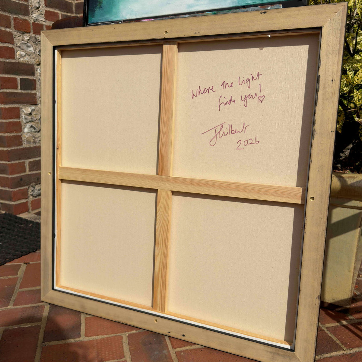 Reverse of Where the Light Finds You by Joanna Gilbert, showing the stretcher bars and signature