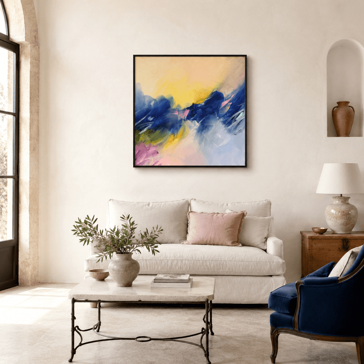 Chasing the Sun, original abstract painting by Joanna Gilbert, above a white sofa in a styled living room