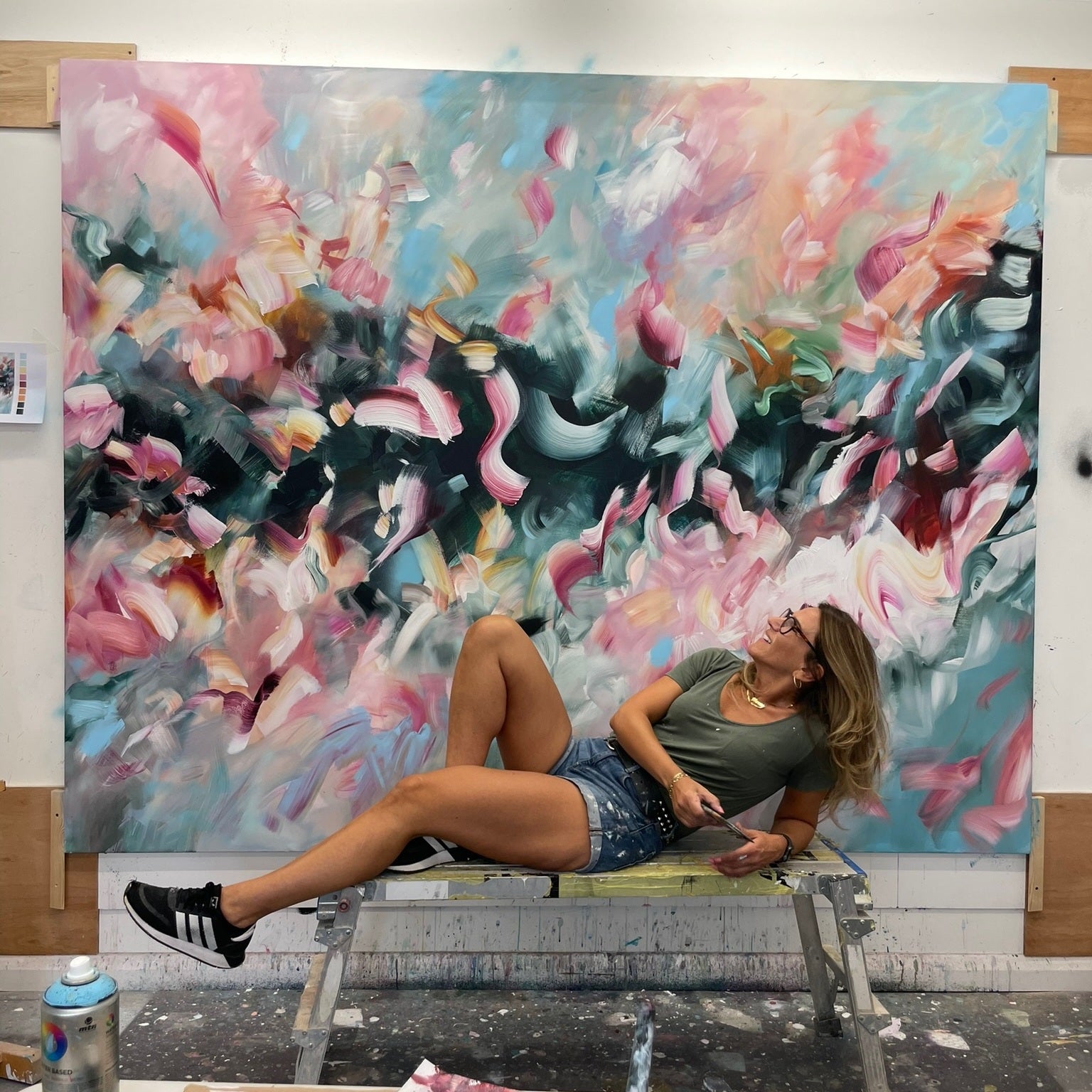 Joanna Gilbert in her studio with a large abstract painting