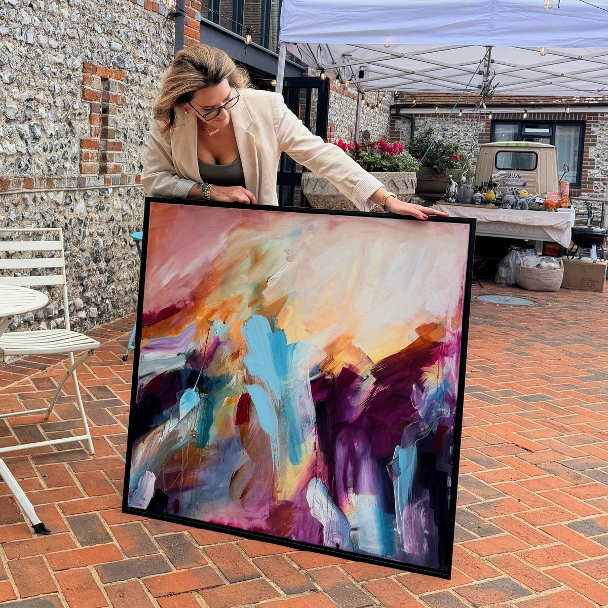 Joanna Gilbert with Rise into Colour, her original abstract painting, at the Arundel Art Trail